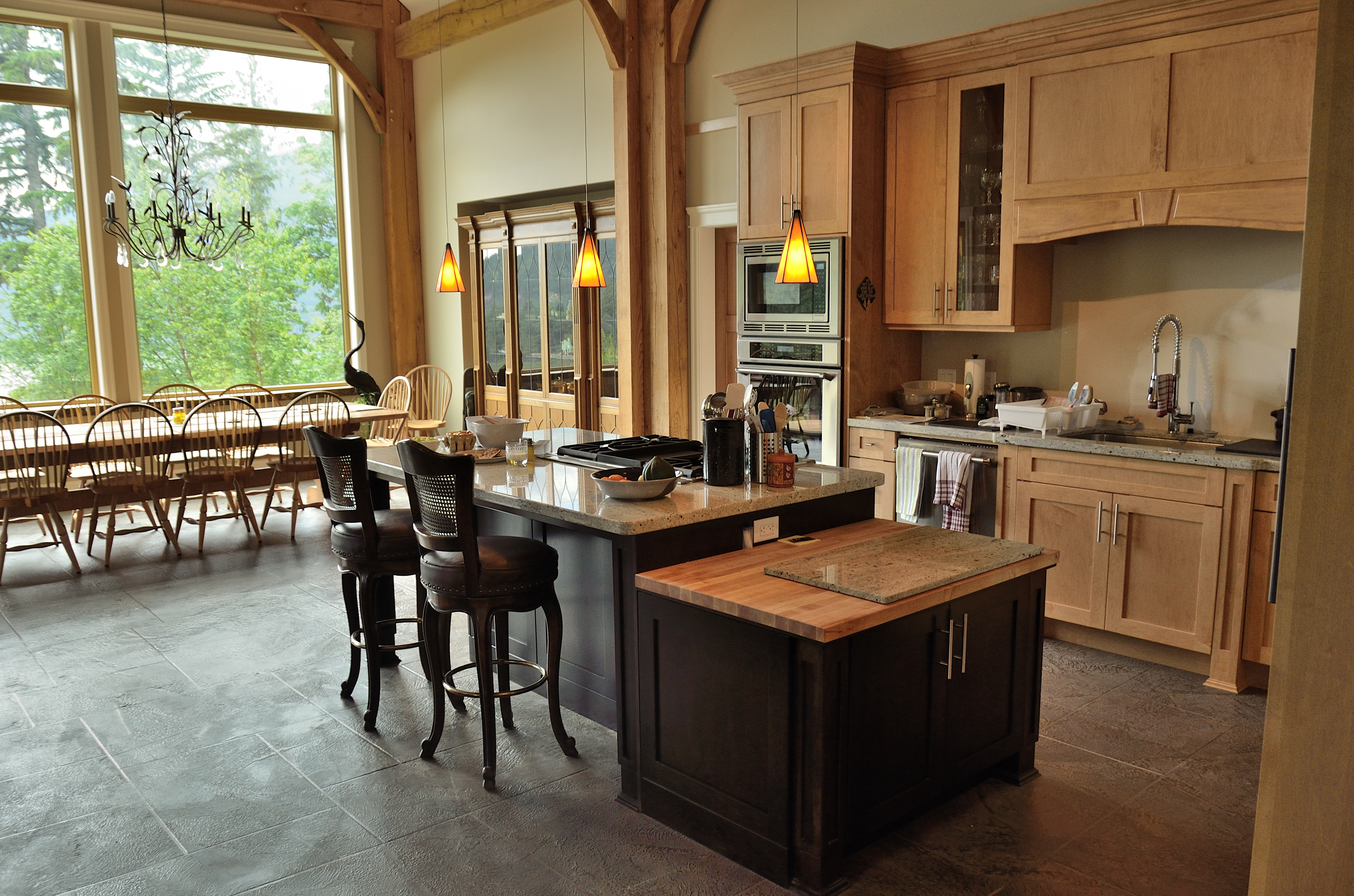 Luxury timber-frame kitchen with panoramic waterfront view