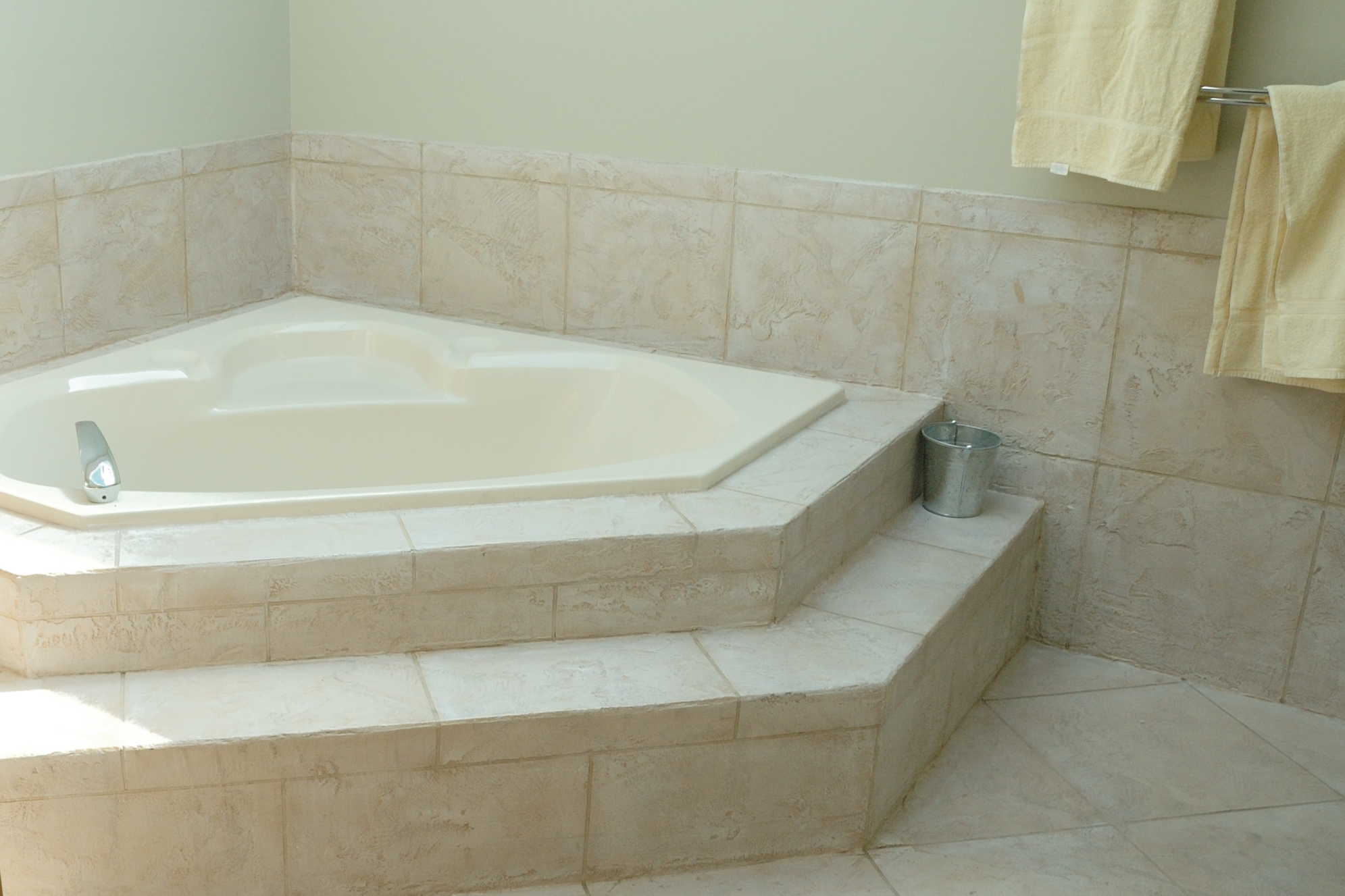 Residential bathroom with soaking tub and custom surfacing